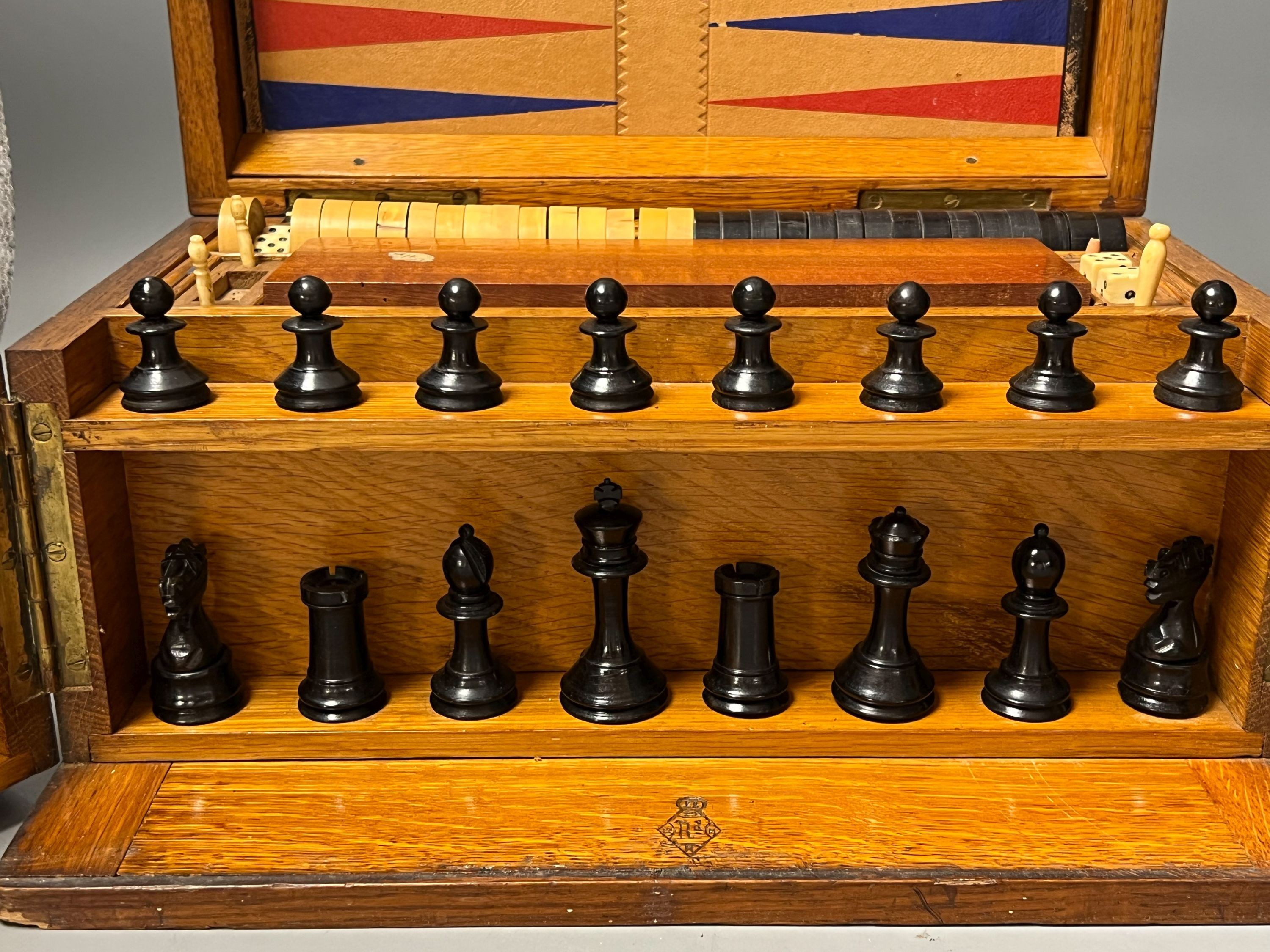 A Victorian oak games compendium, 32cm wide